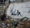 Давид срещу Голиат. Графитите на Banksy в Украйна