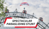 Екстремeн спортист скочи с параглайдер от 65-метрово виенско колело