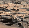 Кратер на Марс е пълен със скъпоценни камъни, намеквайки за възможен микробен живот